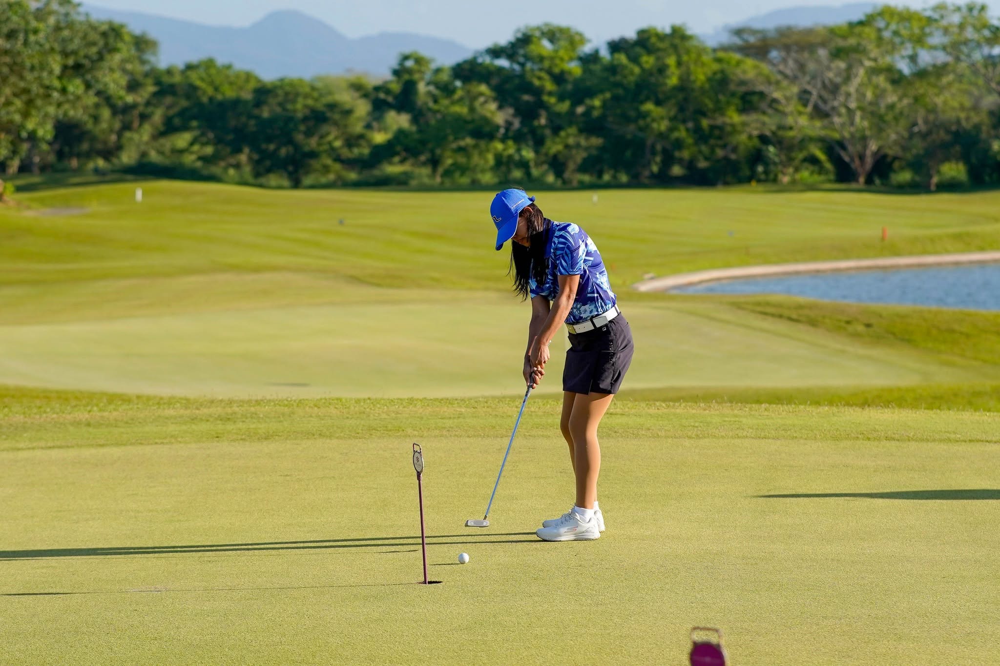 Golfer putting on Summit Point green
